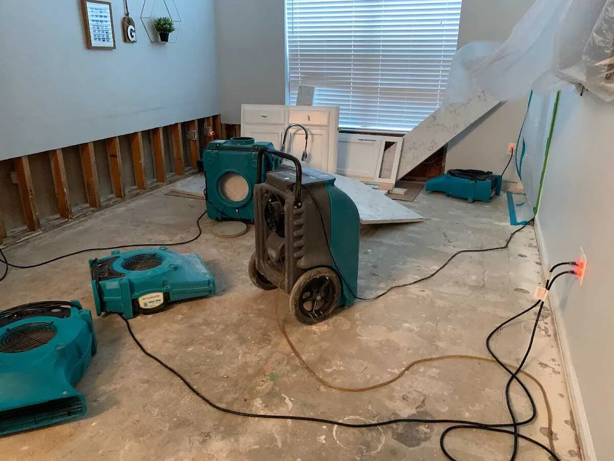 Dehumidifier in flood-cut room for Water Damage Restoration in Ripley